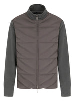 Gray quilted jacket with a plain background