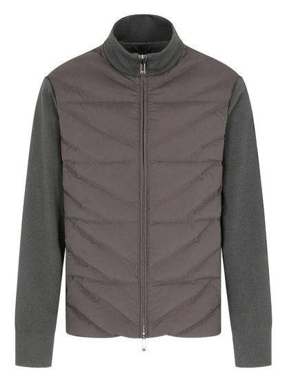 Gray quilted jacket with a plain background