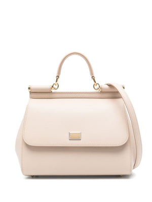 Beige handbag with gold accents on a white background