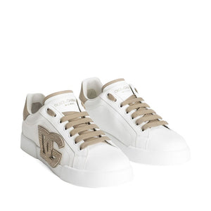 White sneakers with beige accents on a white background