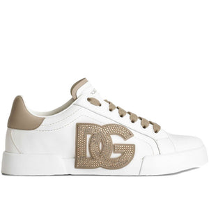 White sneaker with beige accents and a logo on a white background