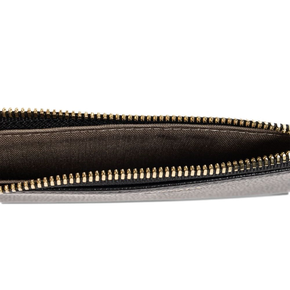 Close-up of a black zipper on a white background