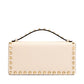Beige handbag with gold studs on a white background