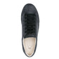 Black suede sneaker on a white background