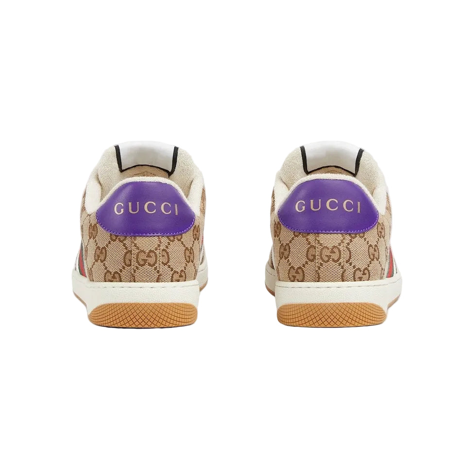 Gucci sneakers with purple logo on a light gray background