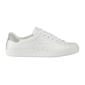 White sneaker with a brand logo on a light gray background