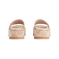 Pair of beige and white patterned sandals on a light gray background