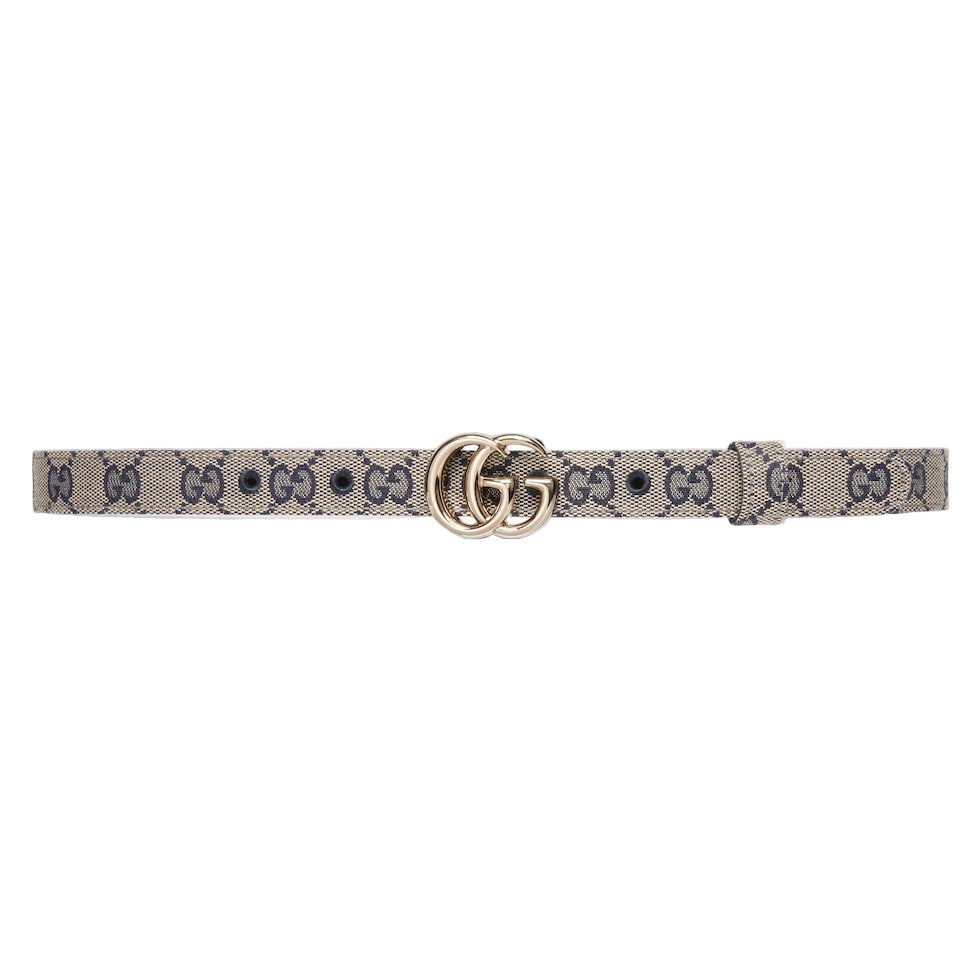 Designer belt with a patterned strap and gold buckle on a light gray background