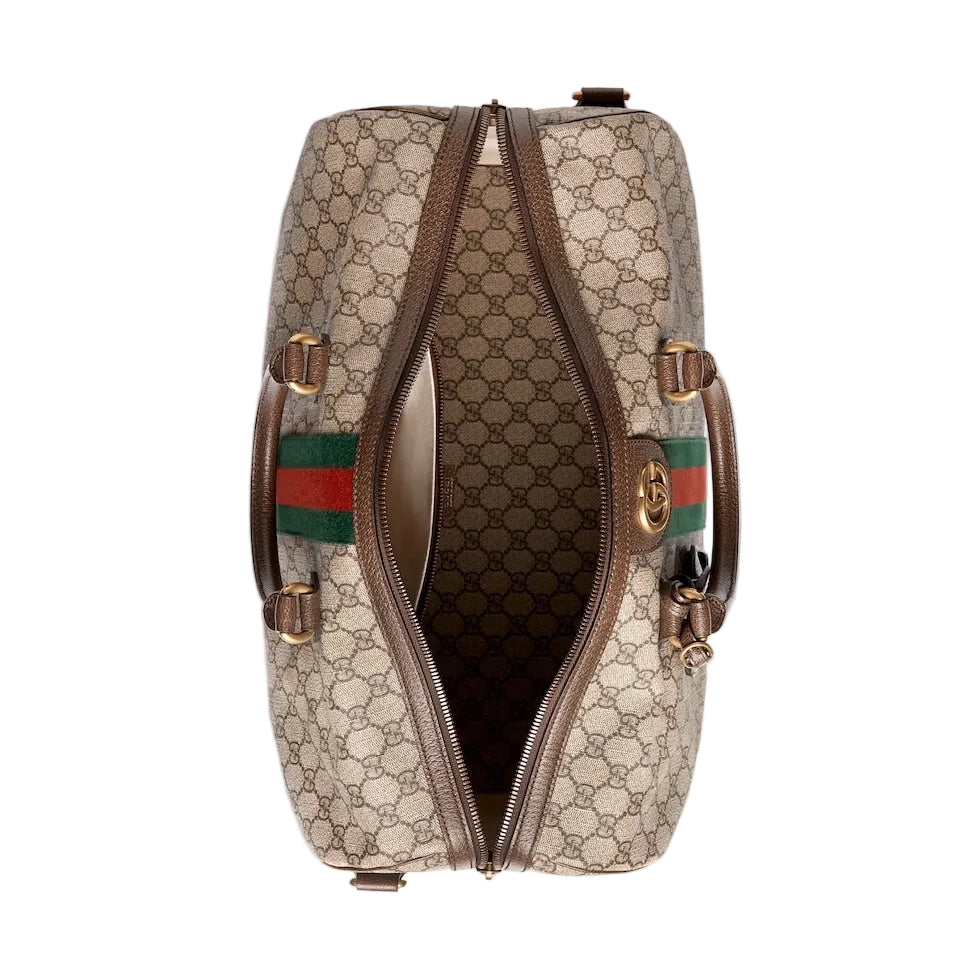 Designer handbag with brand logo and color stripe on a light gray background