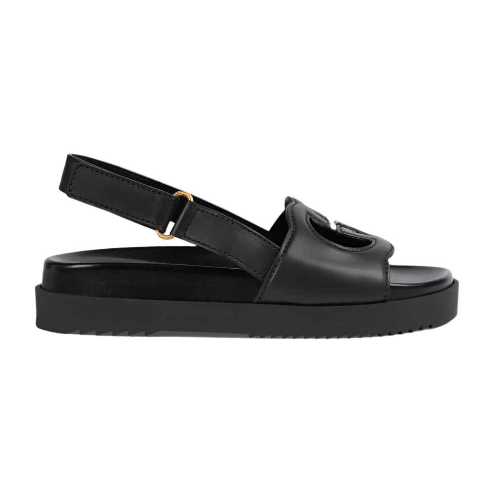 Black sandal with a platform sole on a light gray background