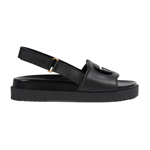 Black sandal with a platform sole on a light gray background
