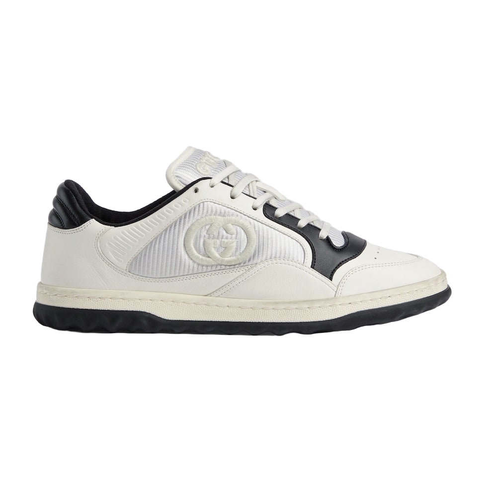 White sneaker with black accents on a light gray background