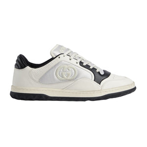 White sneaker with black accents on a light gray background