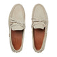 Pair of beige Gucci loafers on a white background