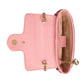 Pink handbag with gold accents on a light gray background