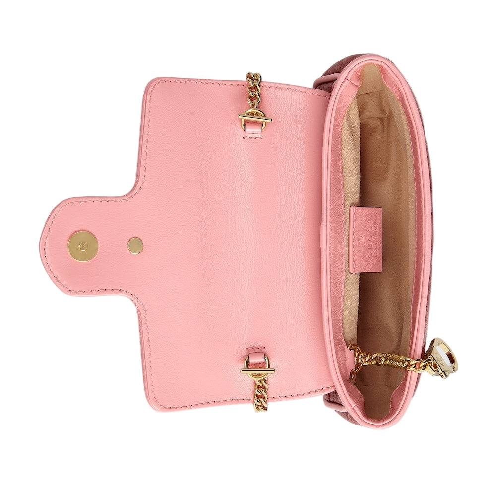 Pink handbag with gold accents on a light gray background