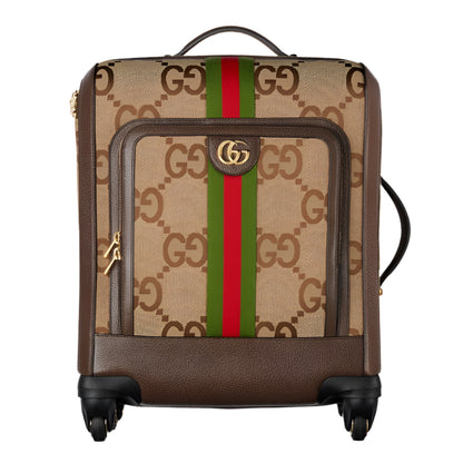Designer Gucci suitcase with brand jumbo logo and color stripes on a white background