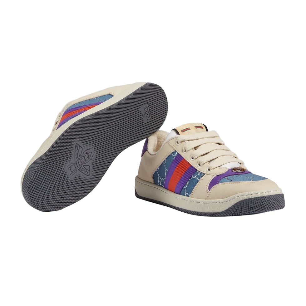 Beige sneaker with colorful stripes on a light gray background