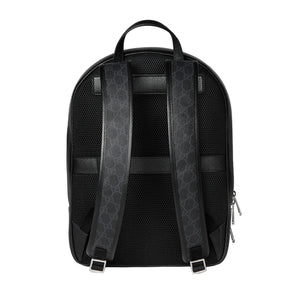 Black backpack with patterned straps on a light gray background