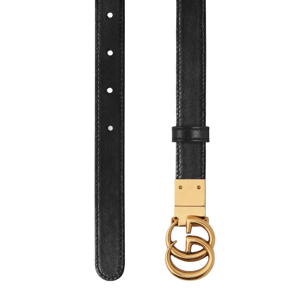 Black belt with a gold buckle on a light gray background