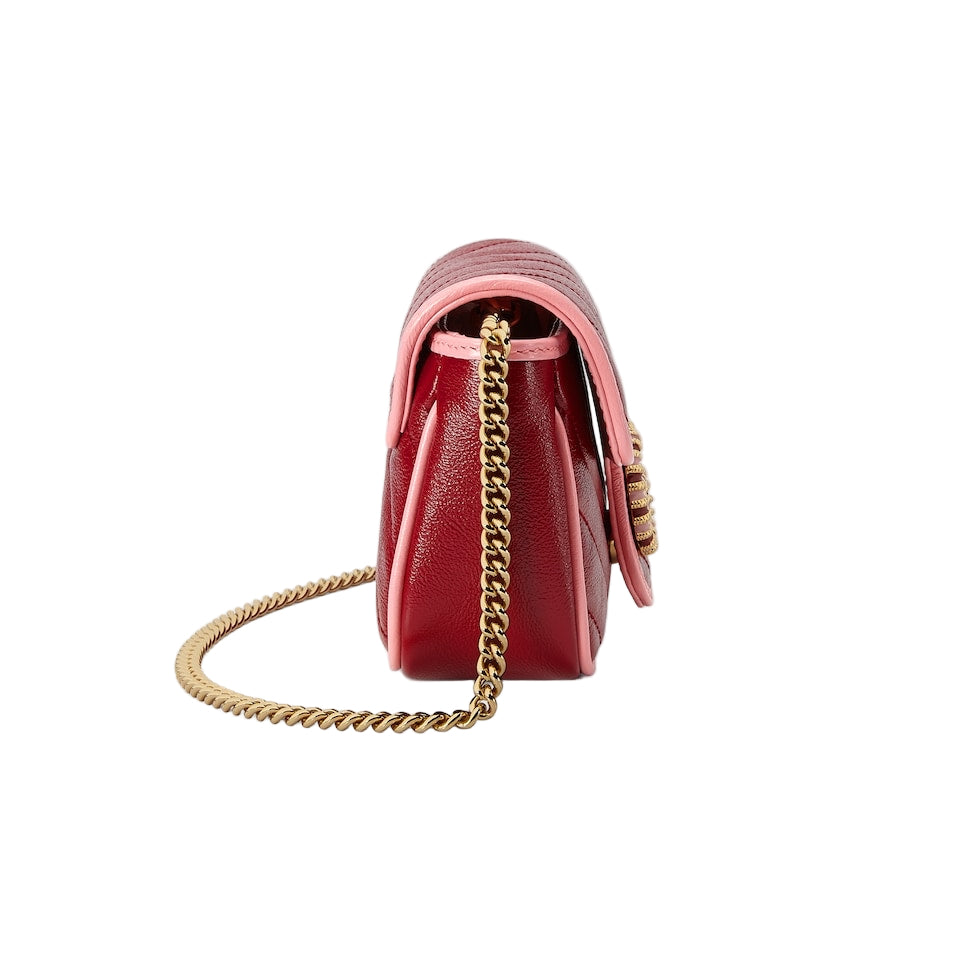 Red handbag with gold chain strap on a light gray background
