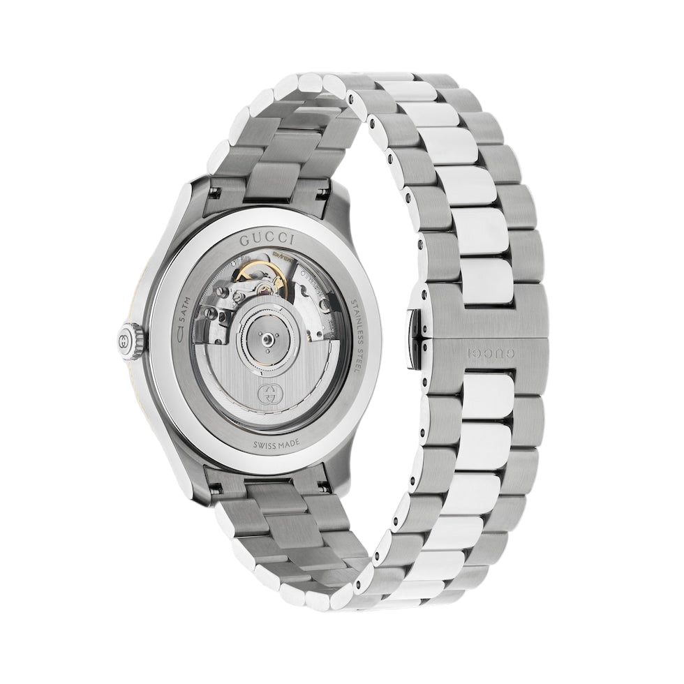 Silver Gucci watch with open face on a light gray background
