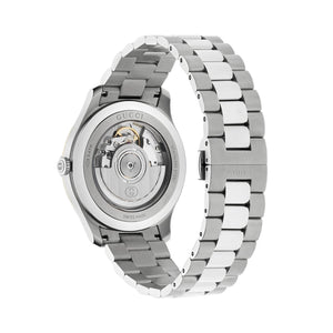 Silver Gucci watch with open face on a light gray background