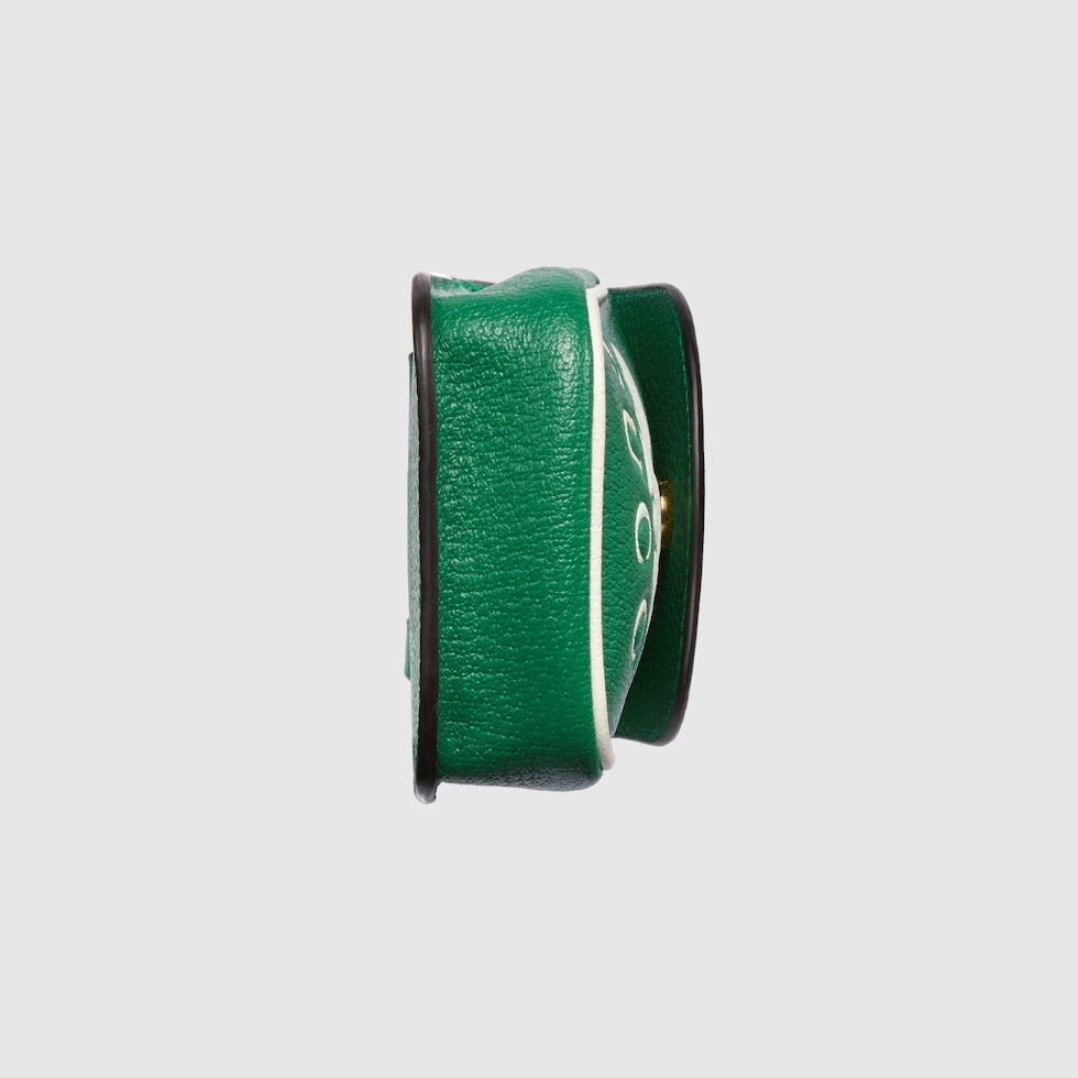 Green leather belt with a silver buckle on a light gray background