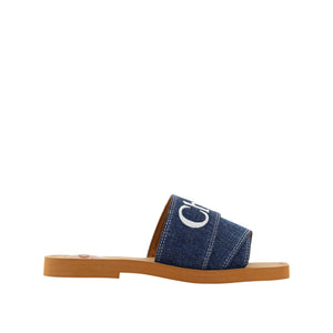 Blue sandal with a wooden sole on a white background