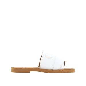 White sandal with a wooden sole on a white background
