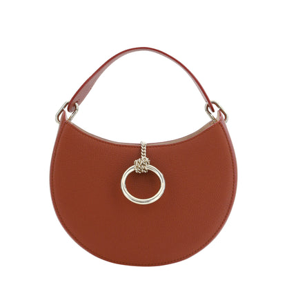 Brown handbag with a gold ring detail on a white background