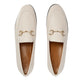 Pair of cream loafers with gold hardware on a light gray background