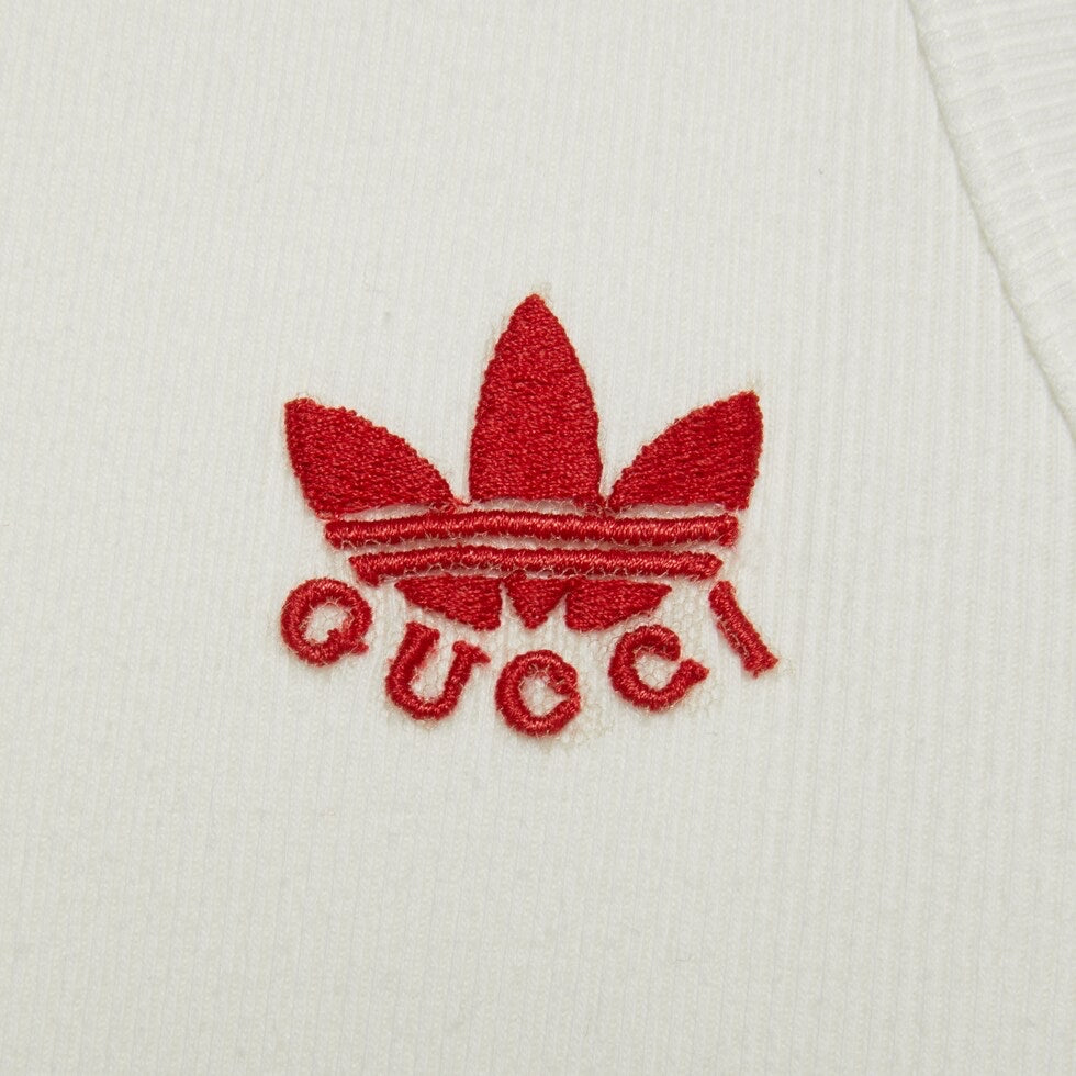 Red embroidered logo on a white background