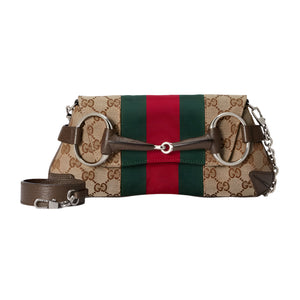 Designer Gucci handbag with a distinctive pattern on a light gray background