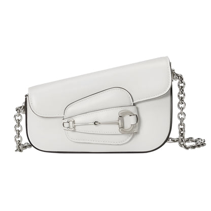 White Gucci horsebit handbag with a chain strap on a light gray background