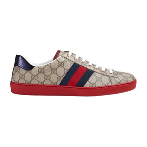 Beige Gucci pre-loved sneaker with red and navy accents on a white background