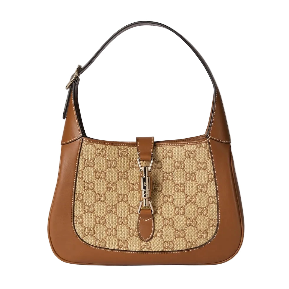 Designer handbag with a prominent brand logo on a light gray background