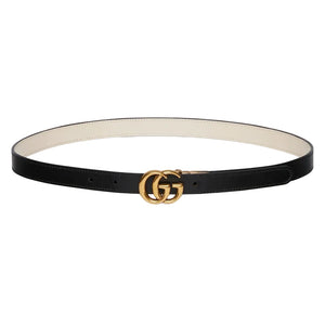 Black belt with gold Gucci logo buckle on a light gray background