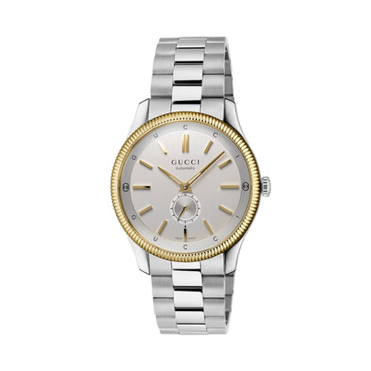 Gucci watch with silver and gold band on a light gray background