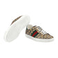 Gucci sneaker with patterned design and white sole on a light gray background