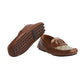 Brown loafers with patterned design on a light gray background