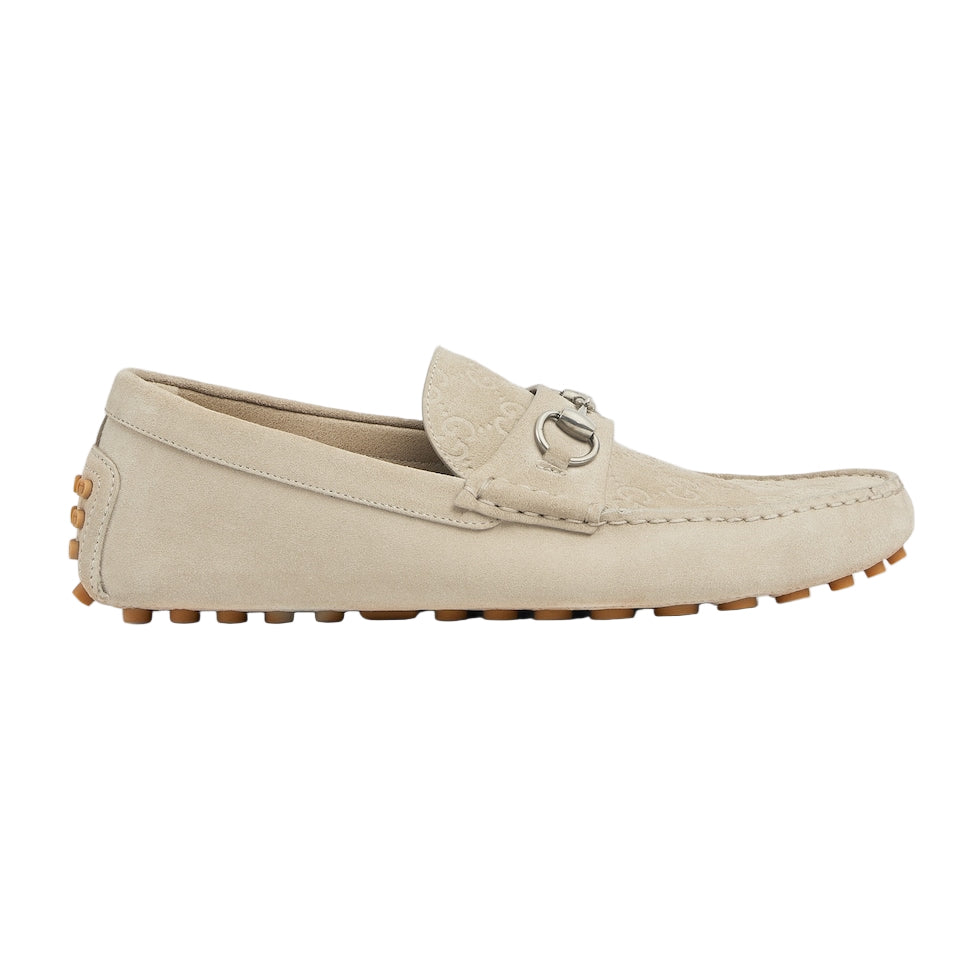 Beige loafer shoe on a light gray background