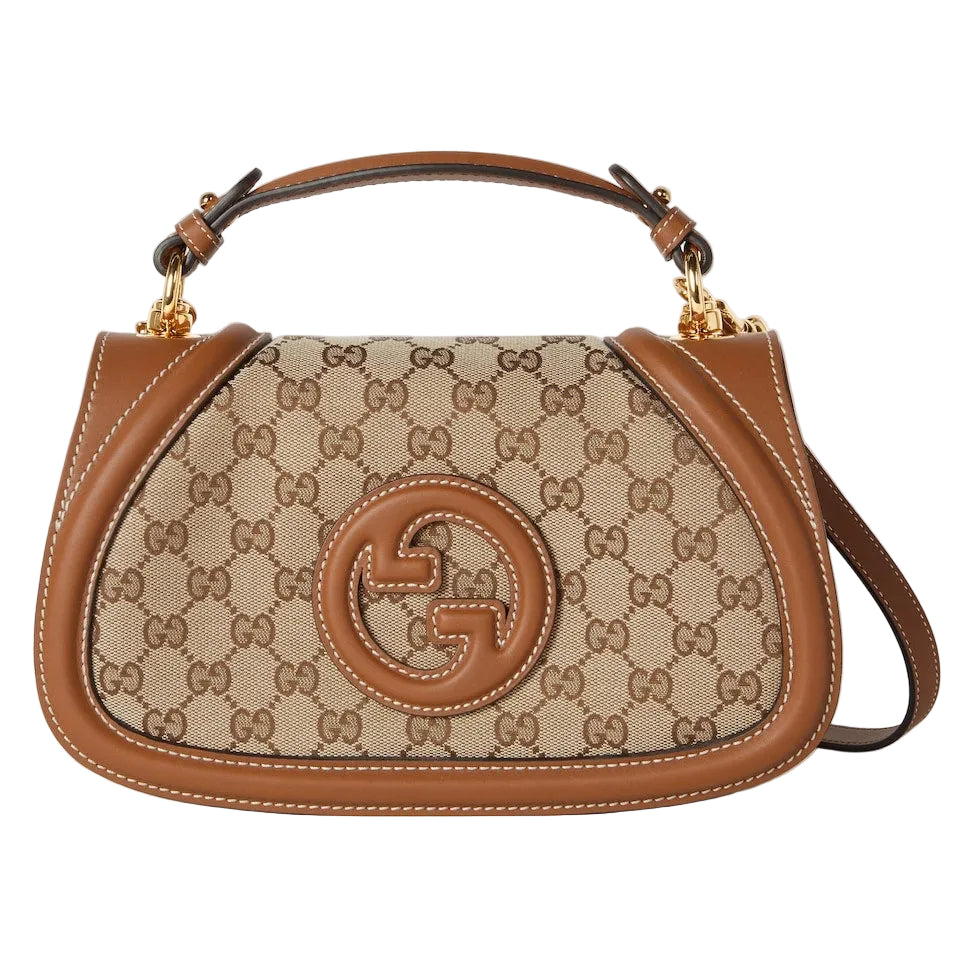 Designer handbag with brand logo on a light gray background