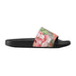 Floral slide sandal with Gucci logo on a light gray background