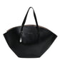 Black handbag with a visible brand name on a white background