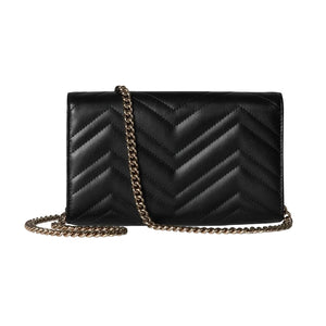 Black chevron-patterned handbag with a gold chain strap on a light gray background