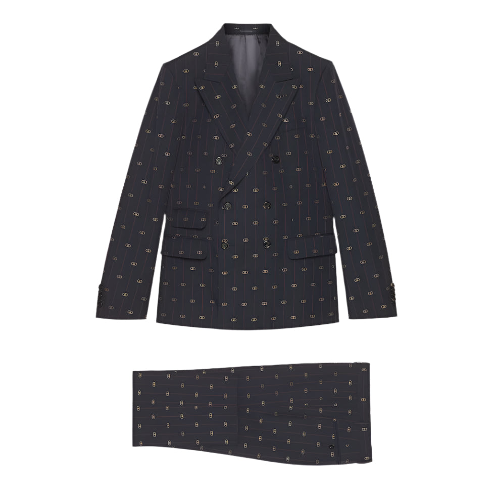 Dark patterned  Gucci GG blazer and matching pocket square on a light gray background
