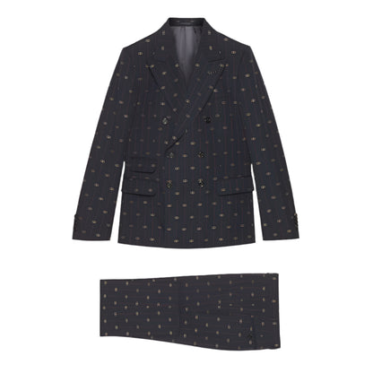 Dark patterned  Gucci GG blazer and matching pocket square on a light gray background