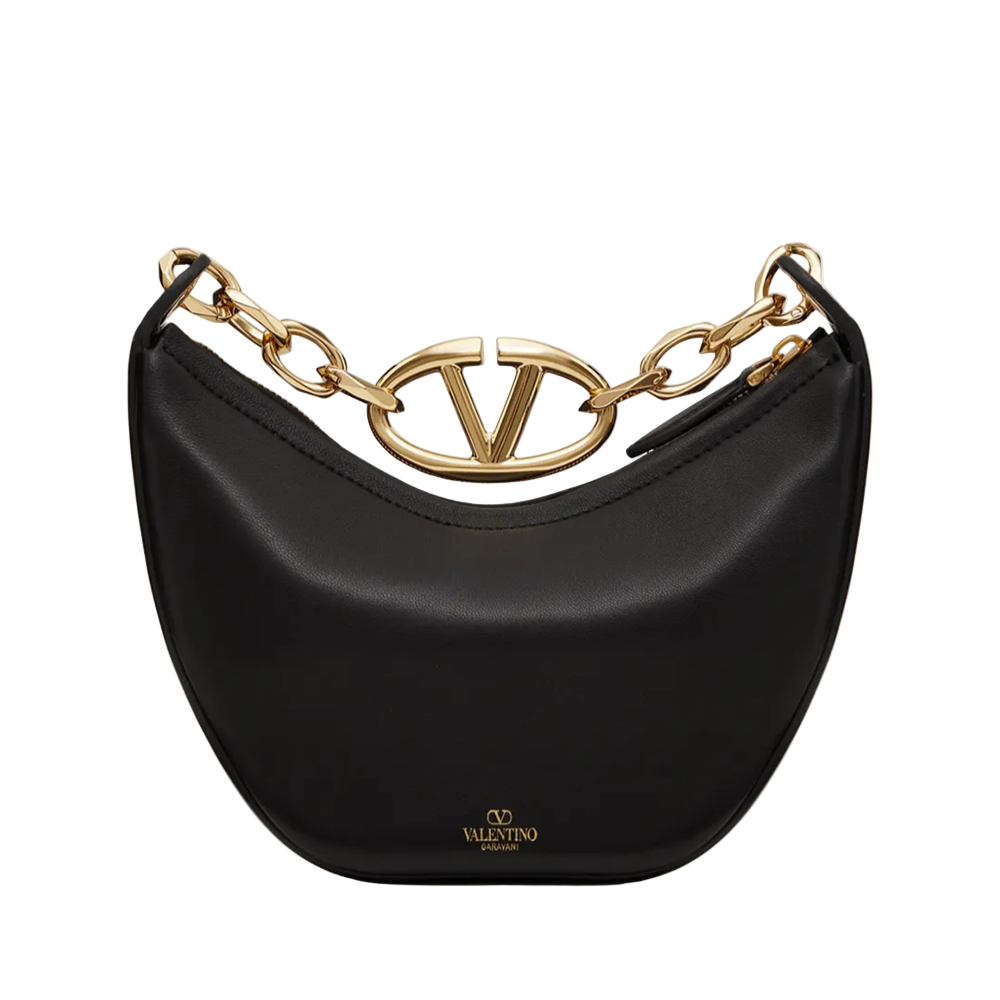 Black handbag with gold chain and logo on a white background