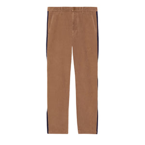 Brown Gucci pants with black side stripes on a light gray background